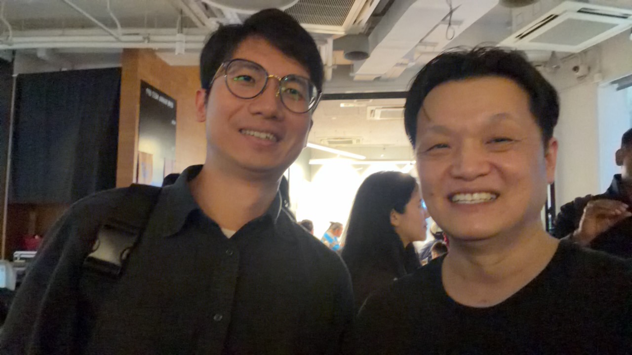 Two attendees smiling together at the networking session