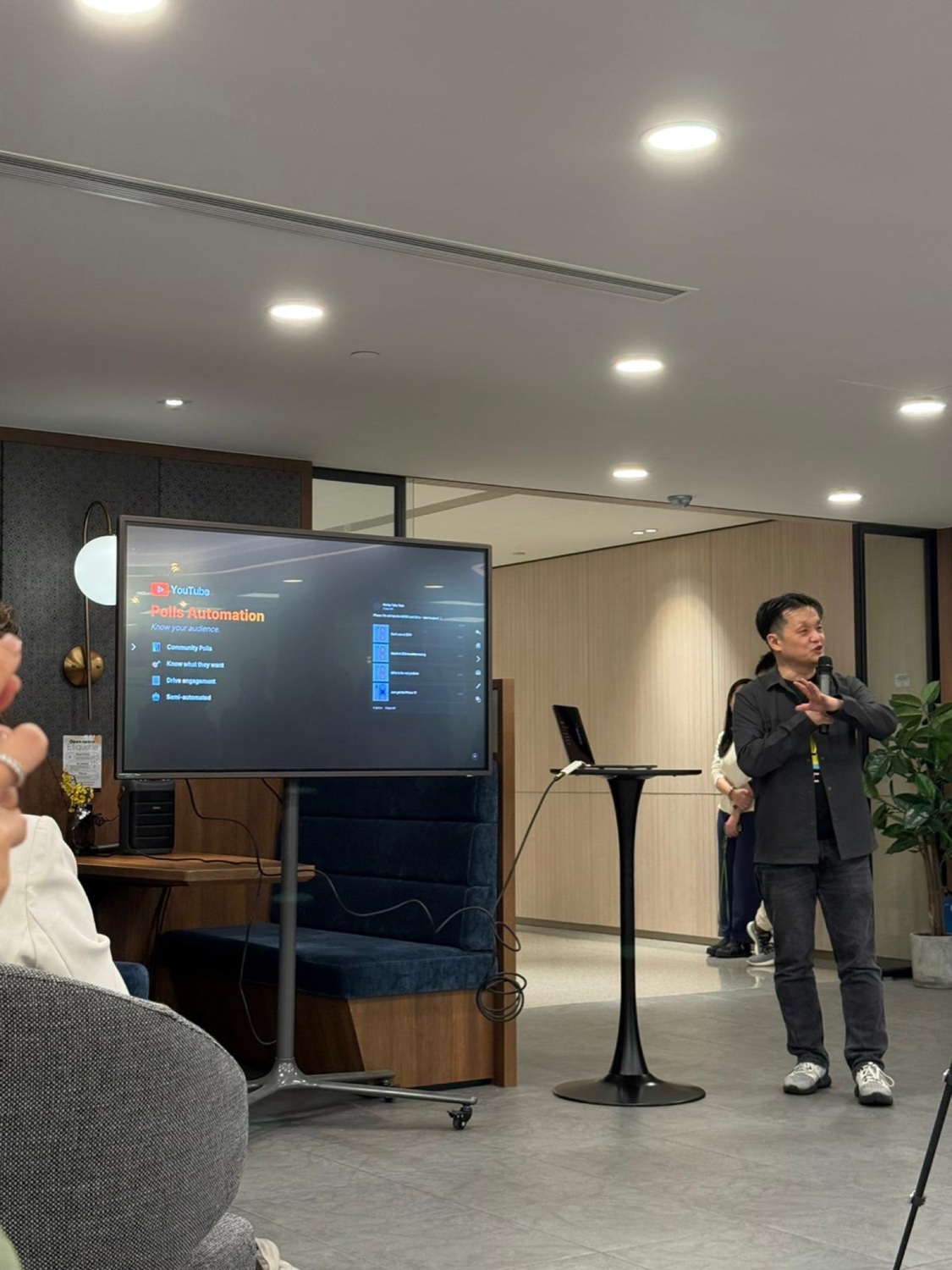 Hanley presenting YouTube Polls Automation slide
