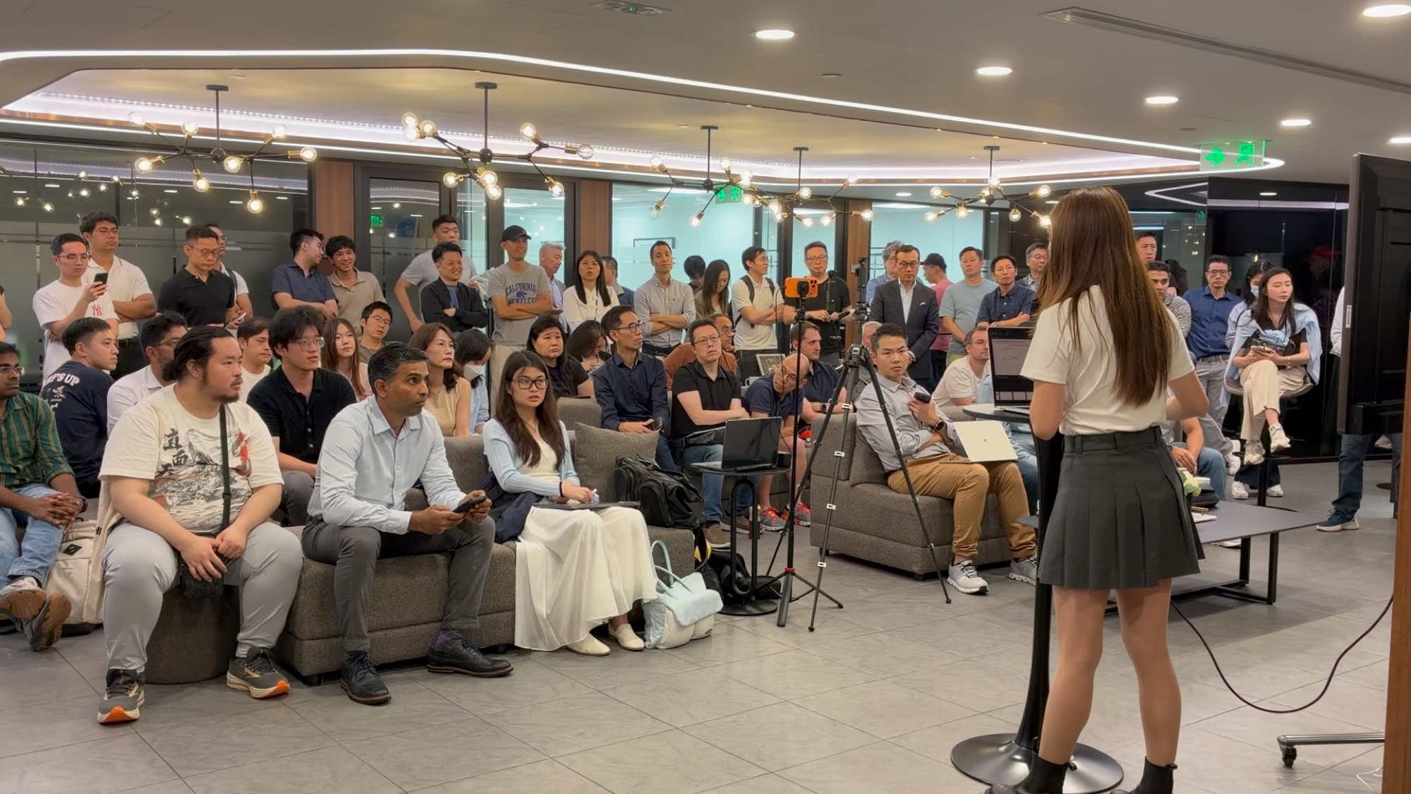 Shally Liu addressing a packed room at Compass Offices for the AI & Trading Workshop