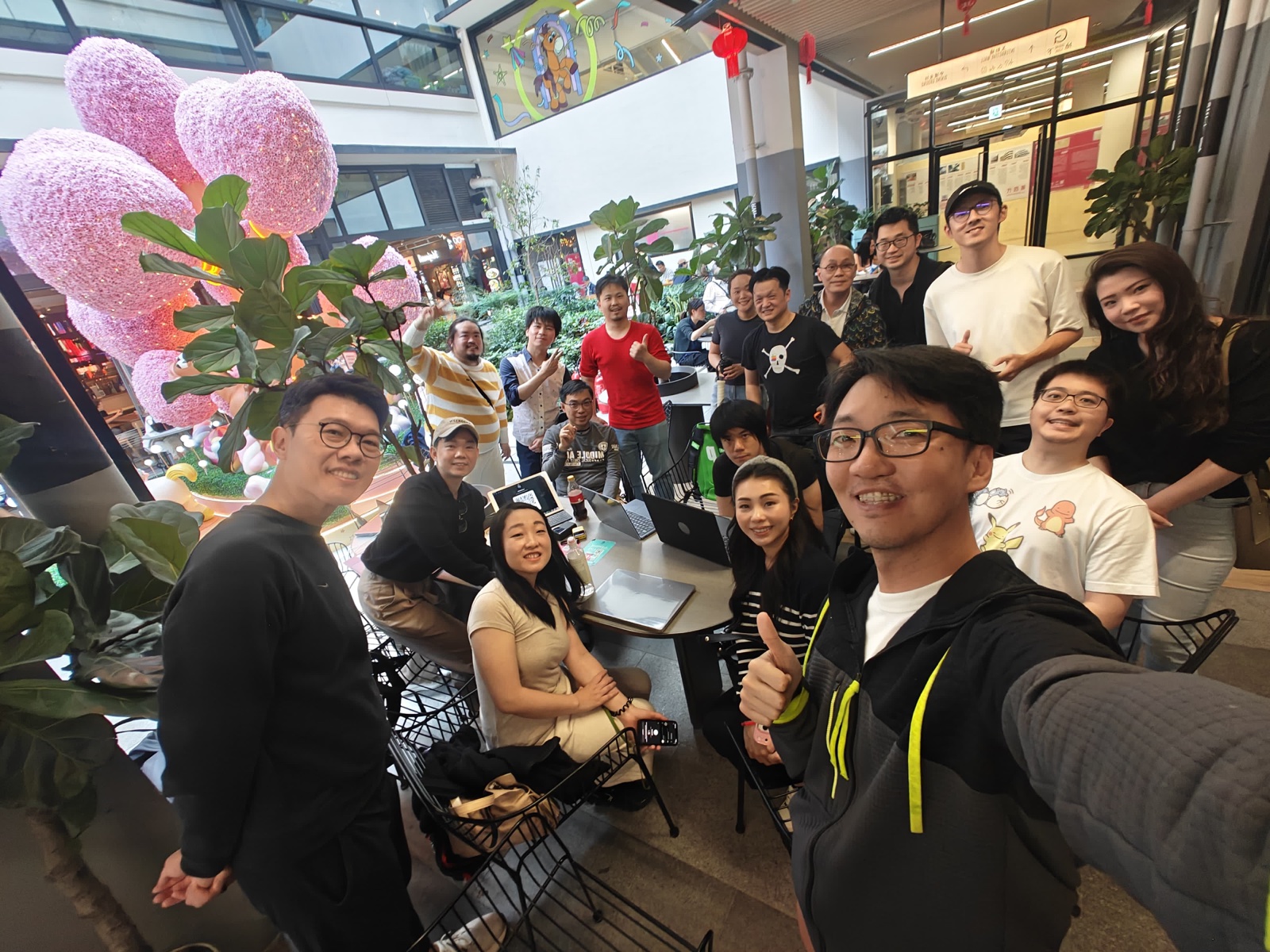 Group selfie of 15+ attendees at the first Lunatechs meetup at Central Market